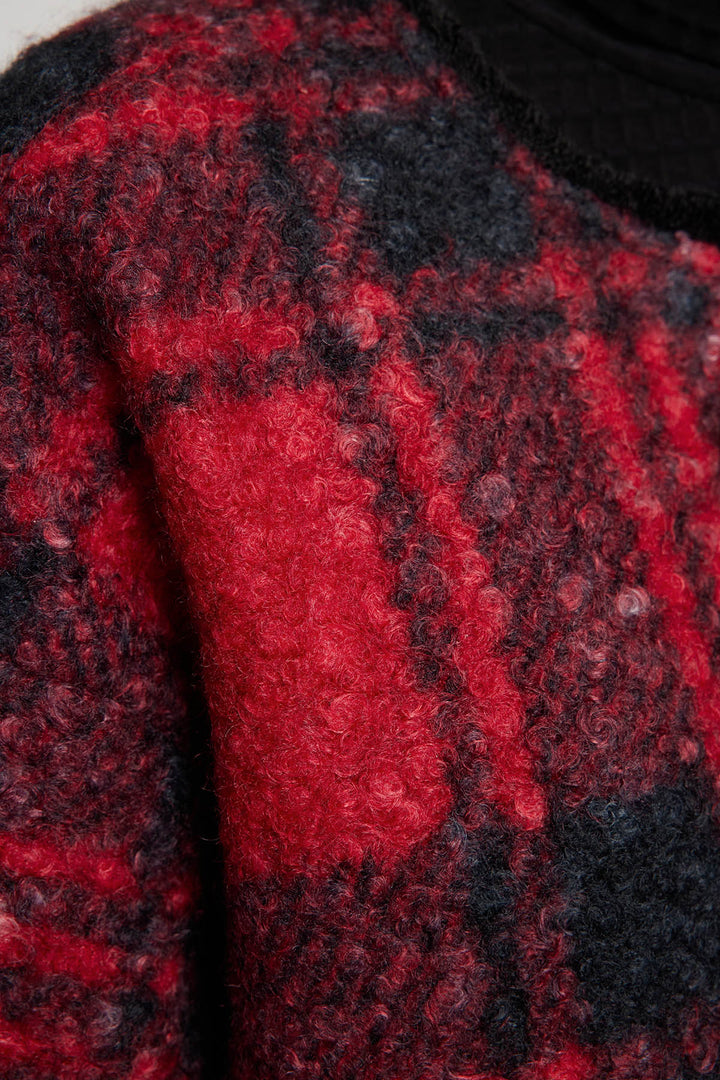 Casaco de lã com grade de botões bordados à mão